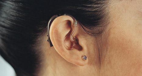 girl wearing hearing aid