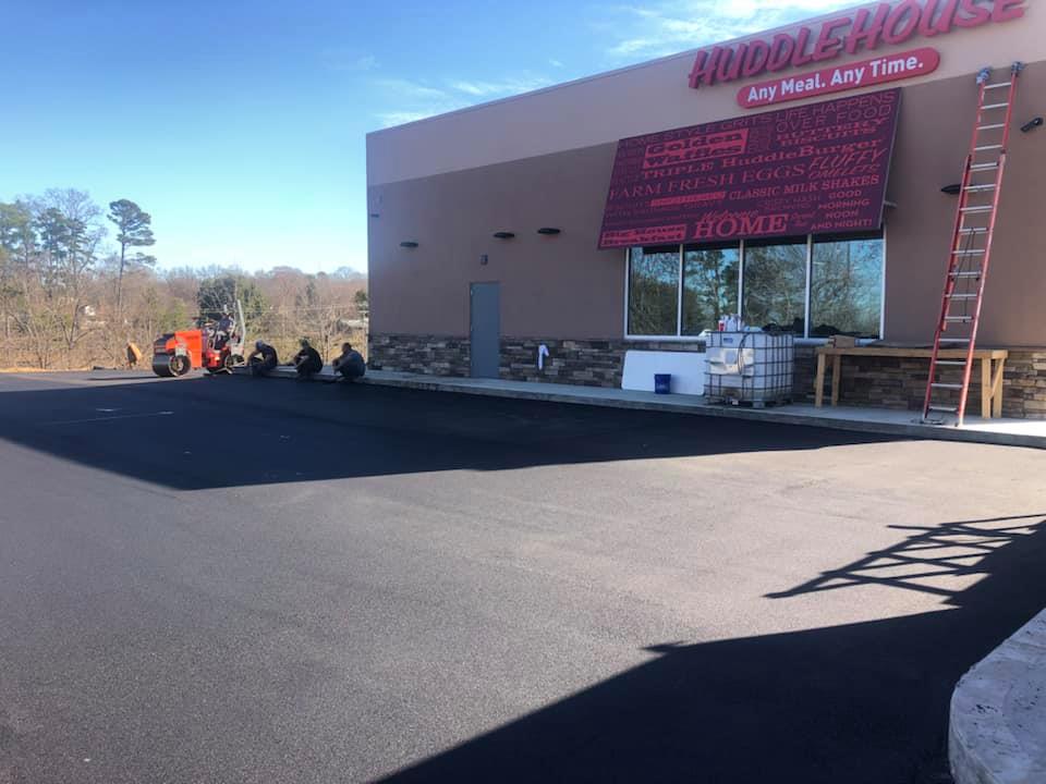 A large building with a red awning is being built.
