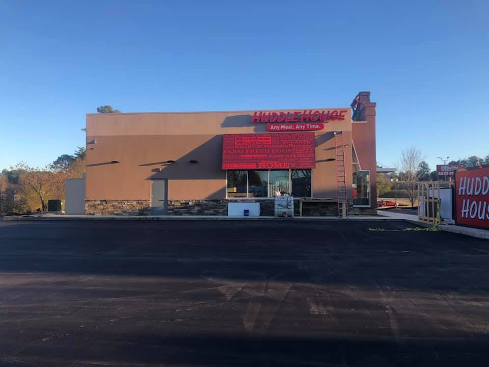 A building with a sign that says hudson house on it