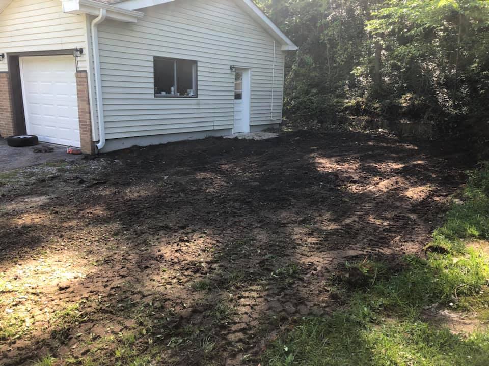 A house with a lot of dirt in front of it