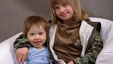 Children on a white couch
