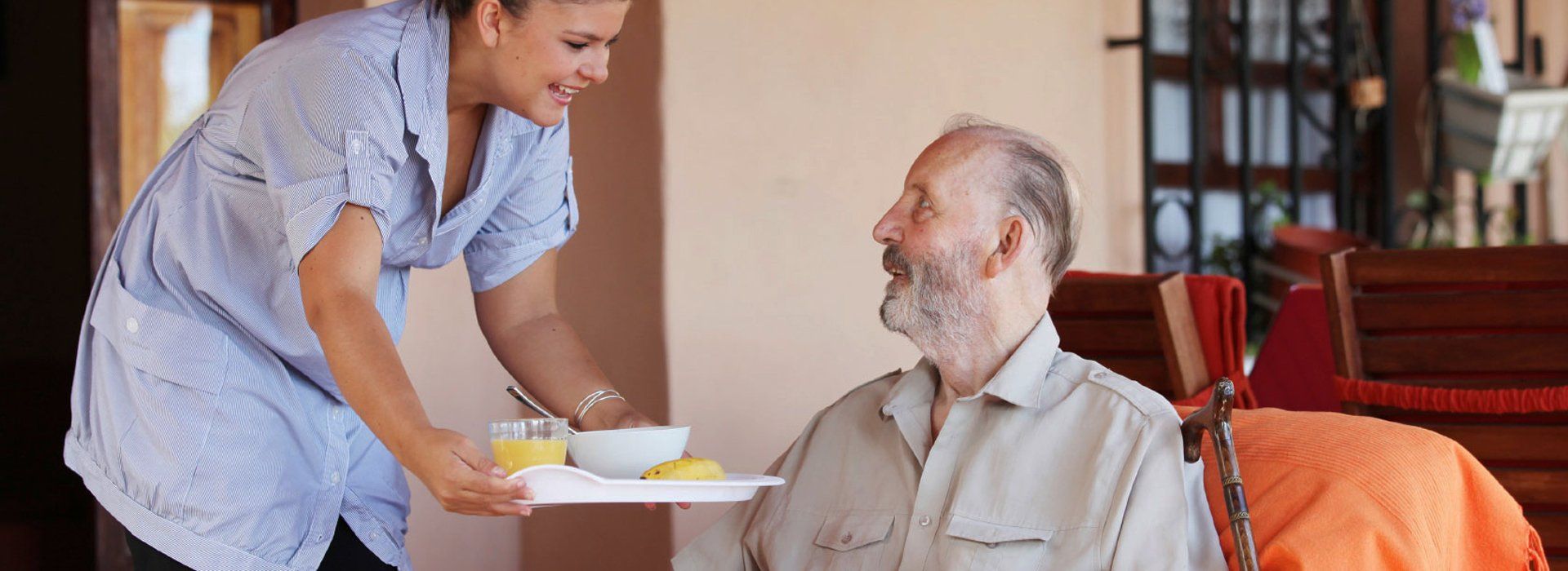 Nurse serving an old man