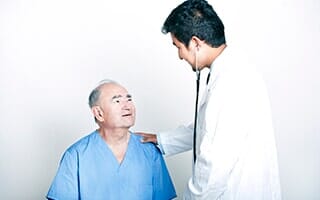 A young Doctor comforting a Senior adult patient — one-stop surgical and non-surgical facility in Orland Park, IL A young Doctor comforting a Senior adult patient — one-stop surgical and non-surgical facility in Orland Park, IL