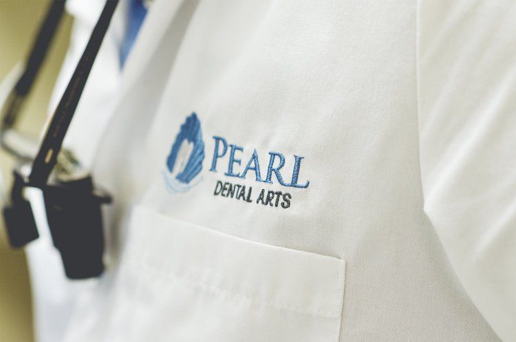 Dental Coat with Logo | Best family dentist for sleep apnea, snap on dentures, implants, and bridges | Monroe Township NJ