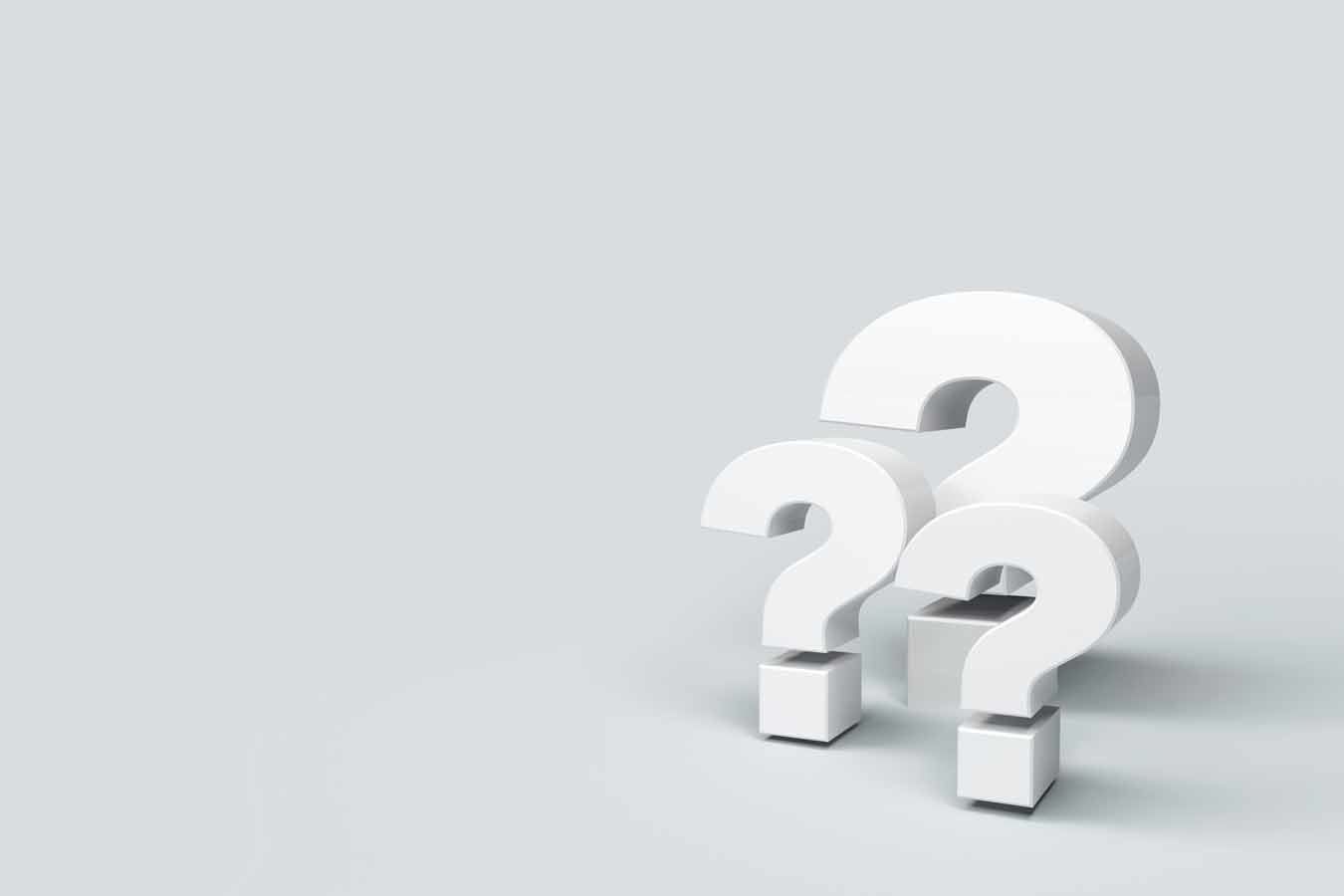 three question marks on background