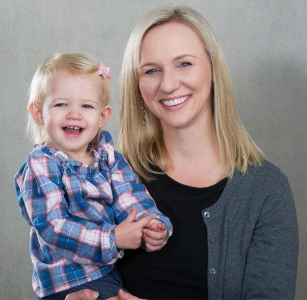 woman and daughter smiling