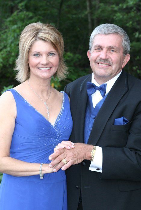 woman in blue dress with husband