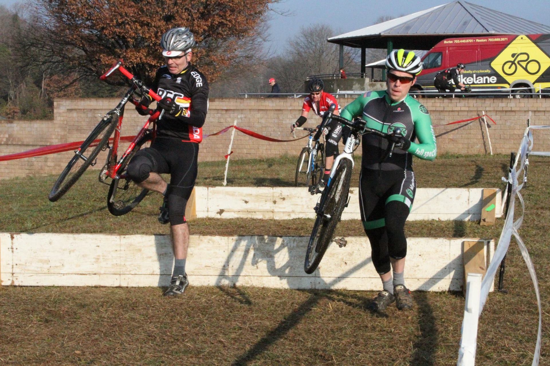 A group of people are riding bicycles on a dirt road.