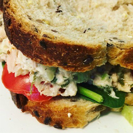 A close up of a sandwich on a white plate