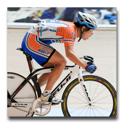 A person is riding a fuji bike on a track