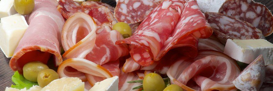 A close up of cured meats and sausage