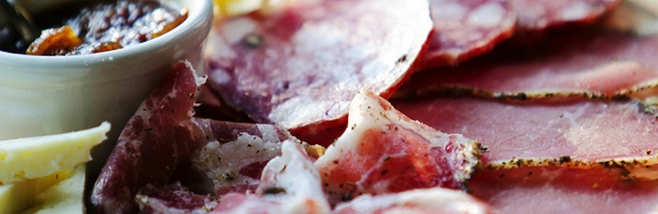 A close up of cured meats