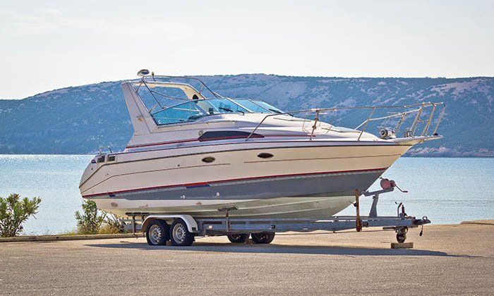 Wide range of vehicles speed boat on trailer