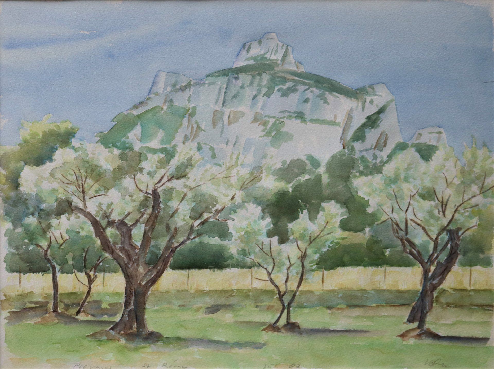 Ein Gemälde von Bäumen mit einem Berg im Hintergrund