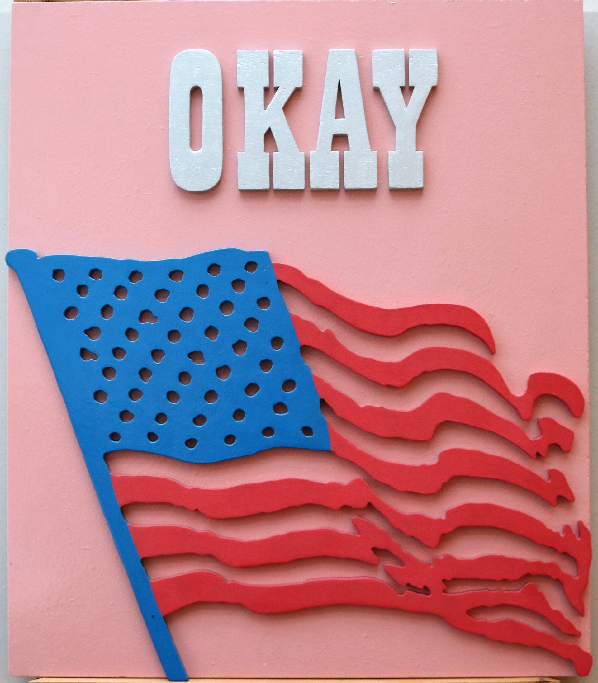 Ein Bild einer amerikanischen Flagge mit dem Wort „Okay“ darüber