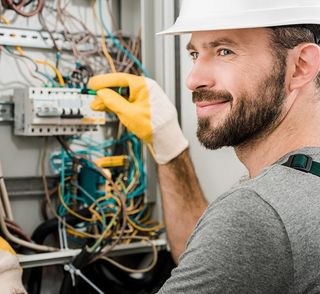 Electrician Repairing Electrical Box — North Alabama — Superior Electrical Service Inc. Electrician Repairing Electrical Box — North Alabama — Superior Electrical Service Inc.