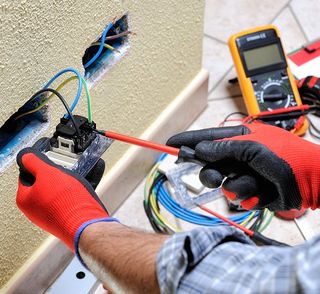 Electrician At Work With Safety Equipment — North Alabama — Superior Electrical Service Inc. Electrician At Work With Safety Equipment — North Alabama — Superior Electrical Service Inc.