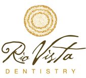 Rio Vista Dentistry logo with gold circular emblem and brown script text on white background