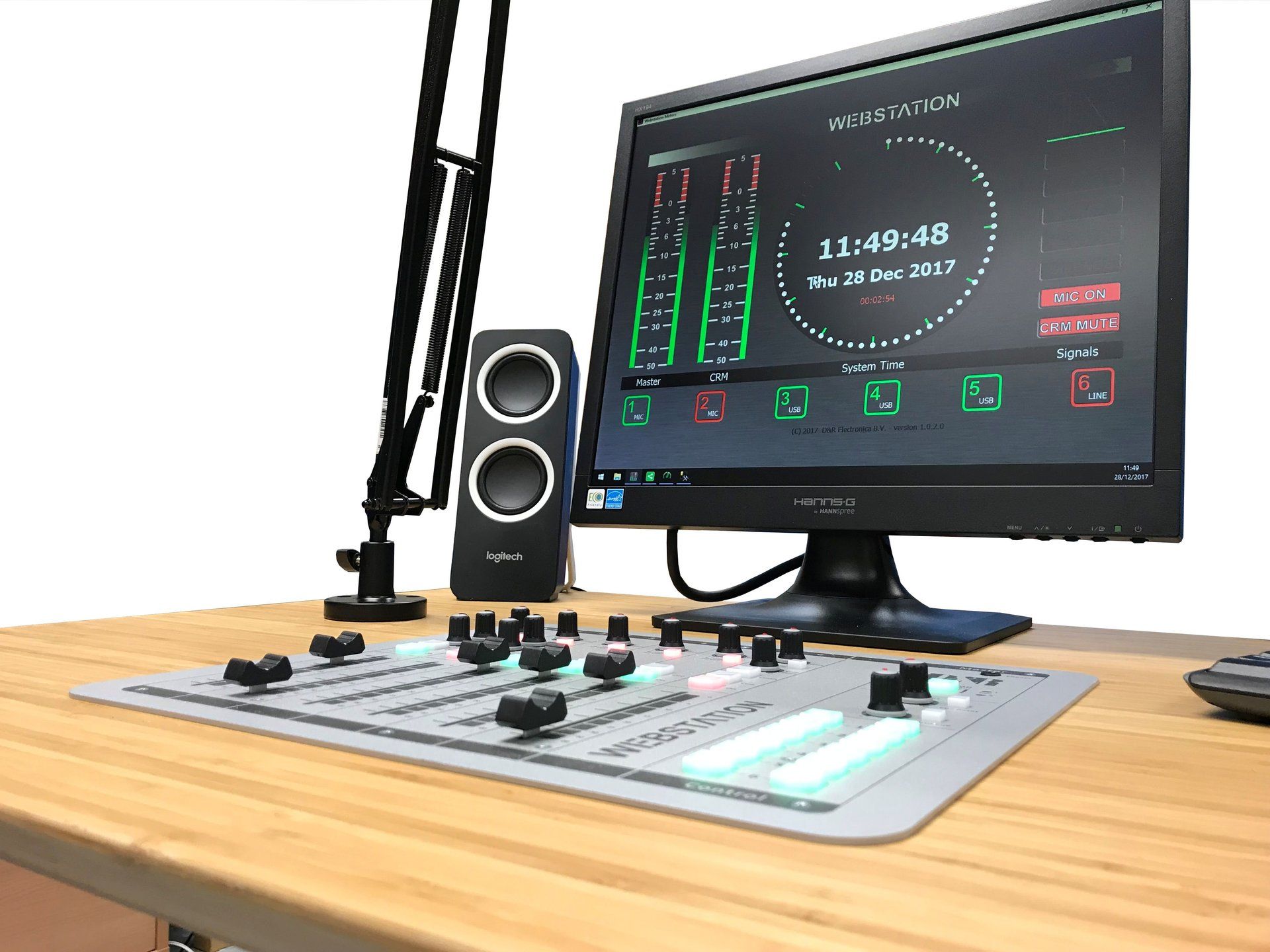 A computer monitor is sitting on top of a wooden desk.