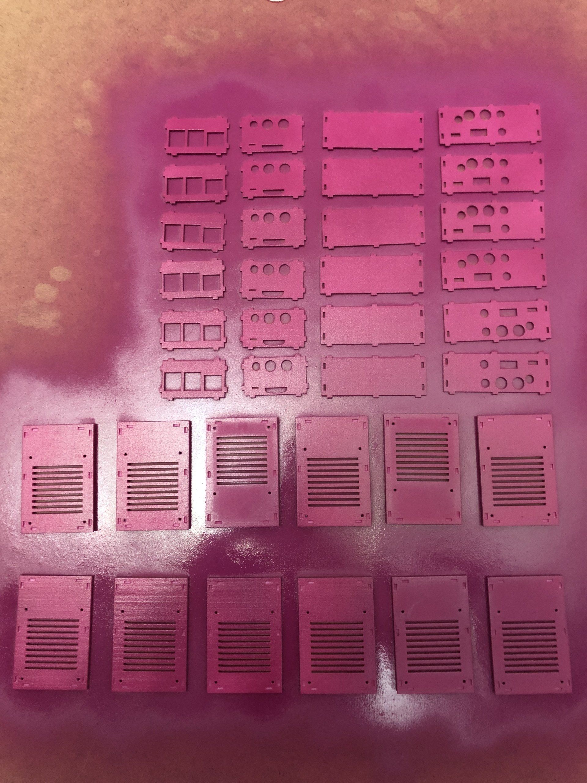 A bunch of pink boxes are sitting on a table