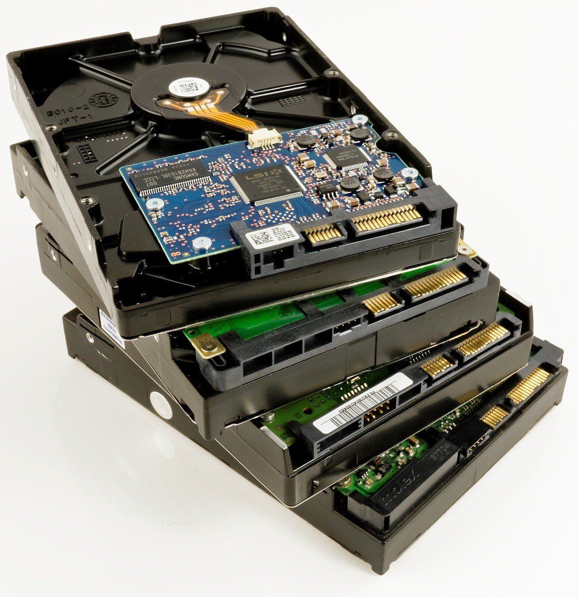 Three hard drives are stacked on top of each other
