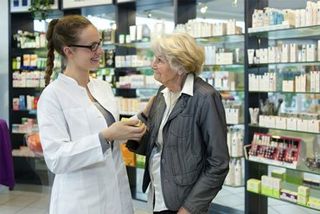 Worker Assisting Customer - Mainfair Pharmacy - Paterson, NJ