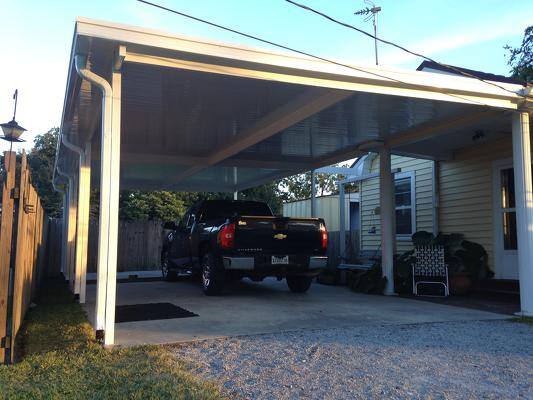 Black Pick-Up Truck Inside Carport — New Orleans, LA — Mike's Patio Covers & Screenrooms