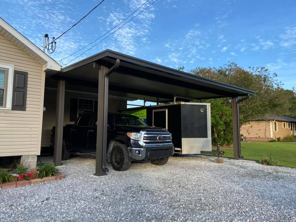 Black Car Inside Carport — New Orleans, LA — Mike's Patio Covers & Screenrooms Black Car Inside Carport — New Orleans, LA — Mike's Patio Covers & Screenrooms
