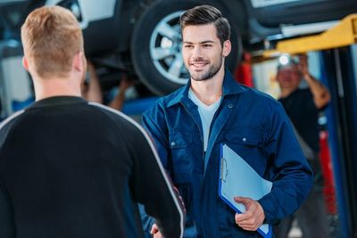 Full Service Auto Repair — Mechanic Welcoming Client in Kokomo, IN Full Service Auto Repair — Mechanic Welcoming Client in Kokomo, IN