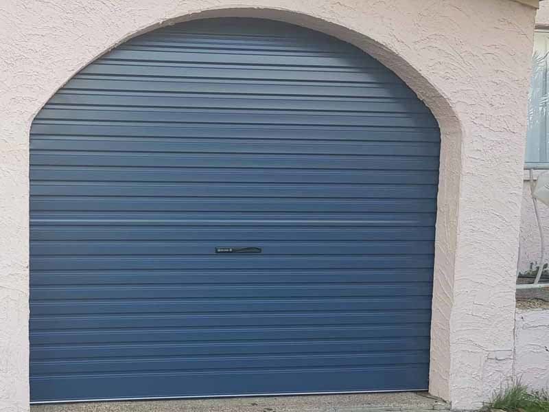 blue garage door with rounded top