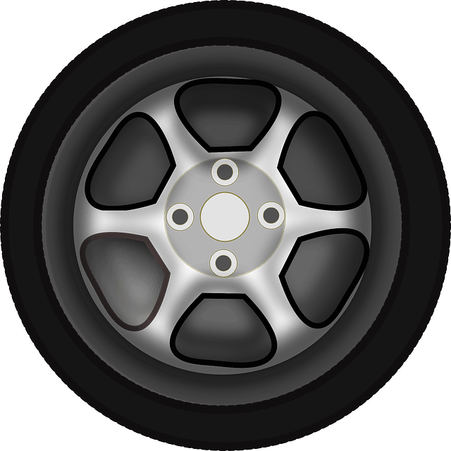 A silver, five-spoke alloy car wheel with a black tire, viewed head-on against a white background.