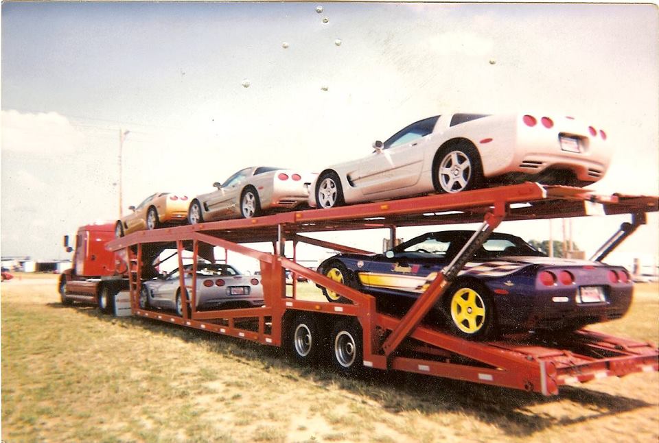Car Carrier — Long Car Carrier and Other Cars in the Road in Chicago, IL Car Carrier — Long Car Carrier and Other Cars in the Road in Chicago, IL