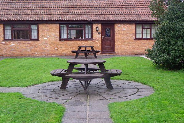 Garden dining area and seating outside Burnham-on-Sea holiday cottage.