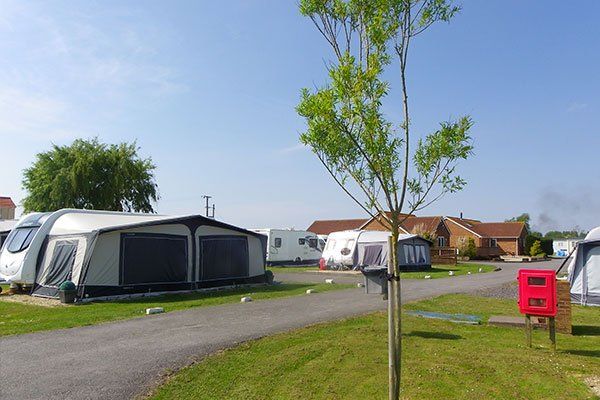 Caravan with awning on a seasonal touring pitch