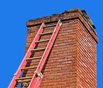 Chimneys Maintenance — Old Chimney with red metal ladder in Lititz, PA Chimneys Maintenance — Old Chimney with red metal ladder in Lititz, PA