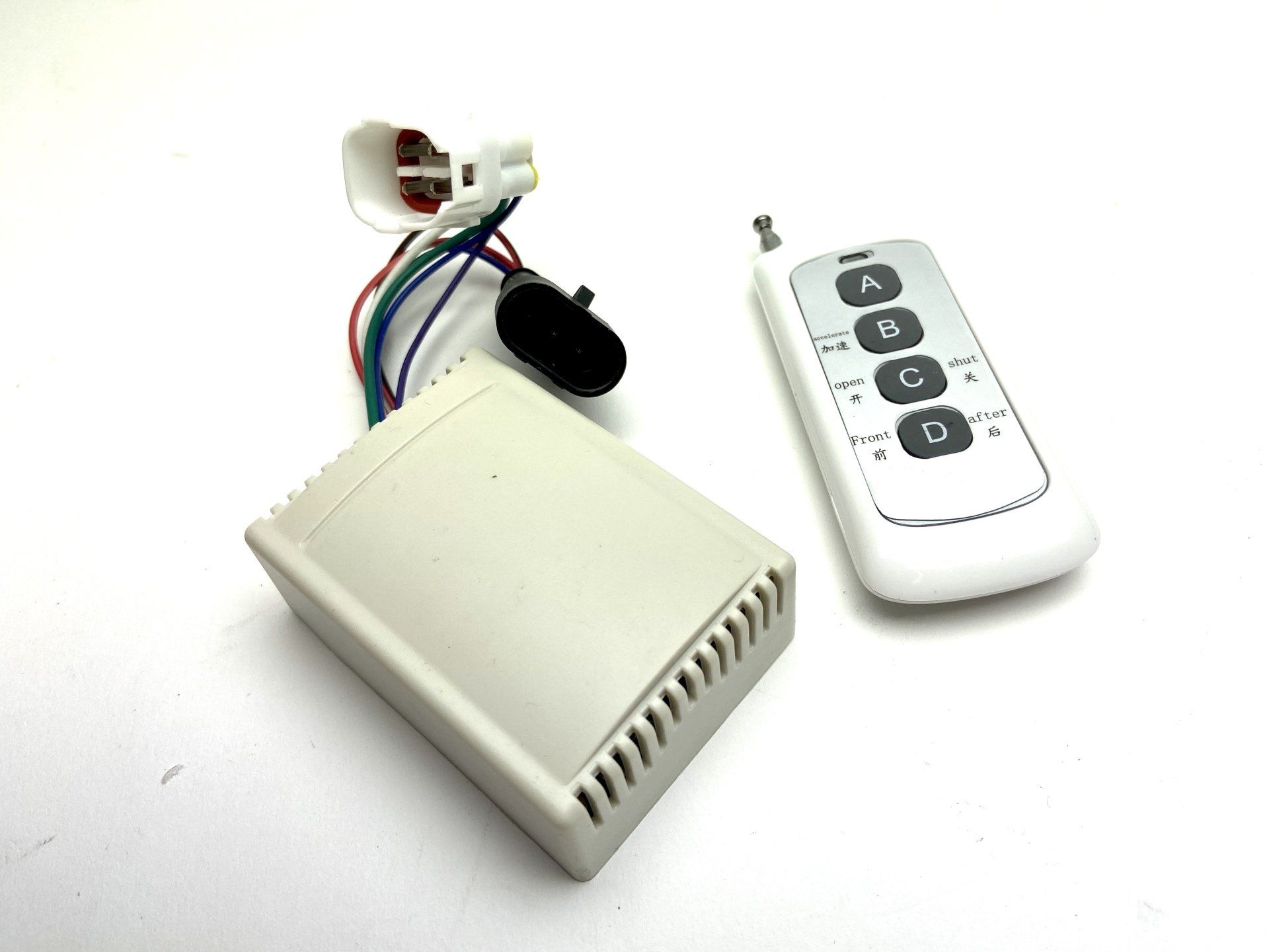 A remote control with the letters a b c and d on it