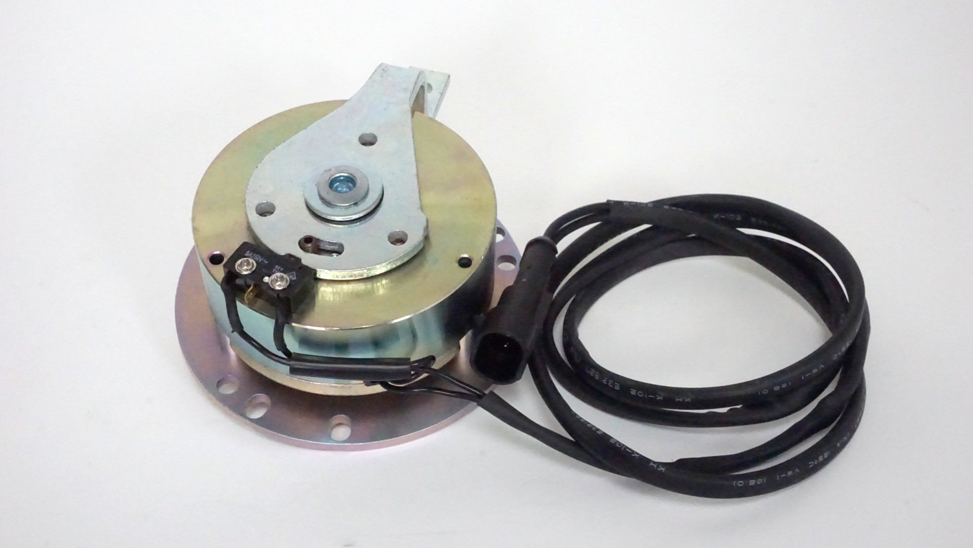 A close up of a motor with a cable attached to it