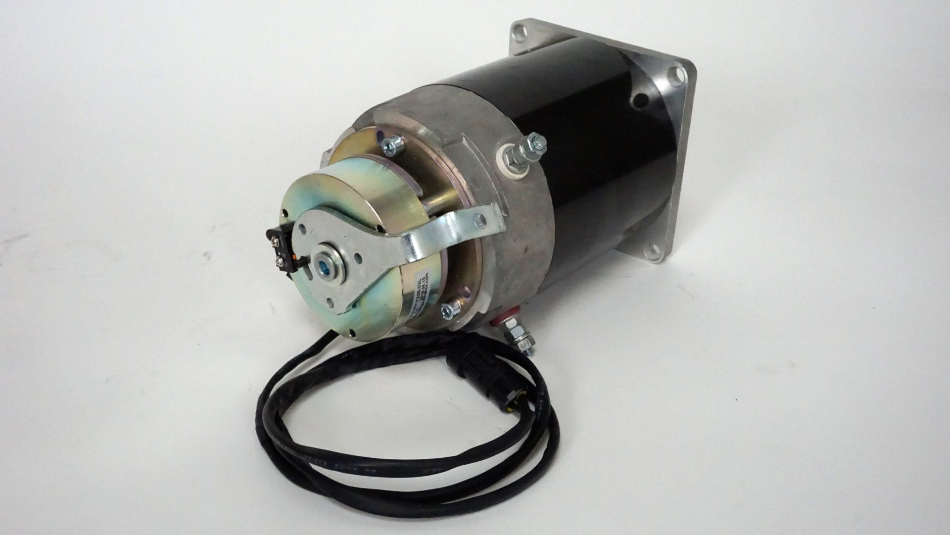 A black motor with two wires attached to it
