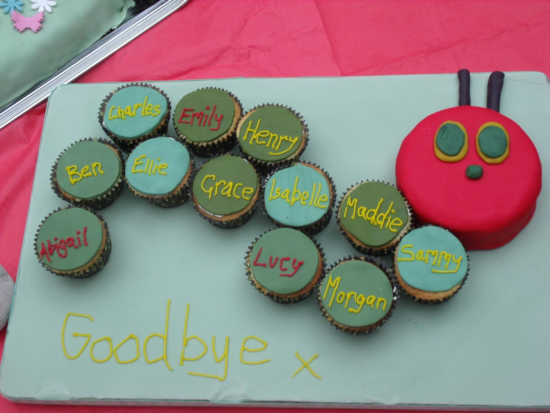 A caterpillar made out of cupcakes with the words goodbye written on it