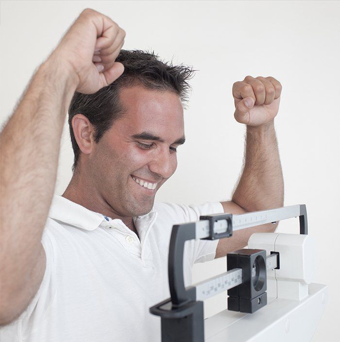 Man Happy with His Weight — Decatur, AL — Decatur Internal Medicine & Aesthetics Man Happy with His Weight — Decatur, AL — Decatur Internal Medicine & Aesthetics