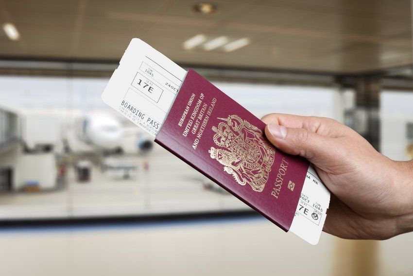 Handing over boarding pass and passport to embark on a flight in an airport