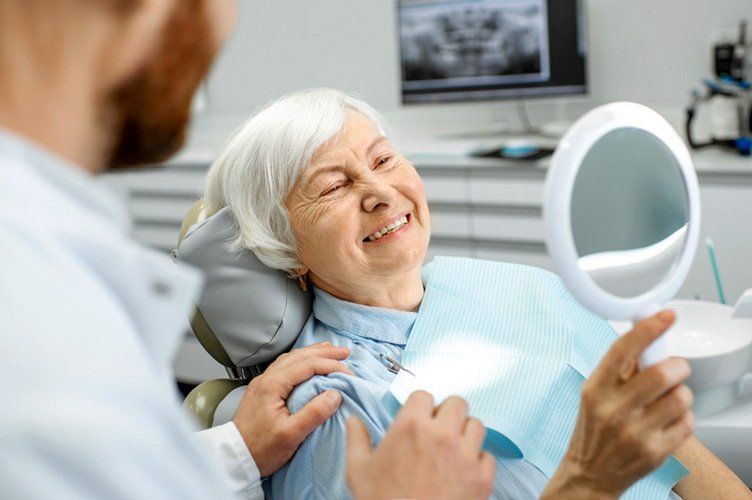 elderly Woma smiling Dental Chair in Round Rock, TX