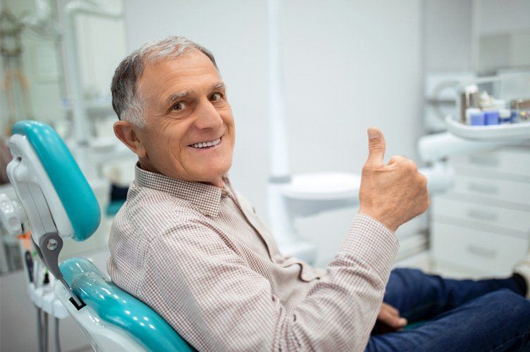 elderly man smiling Dental Chair in Round Rock, TX