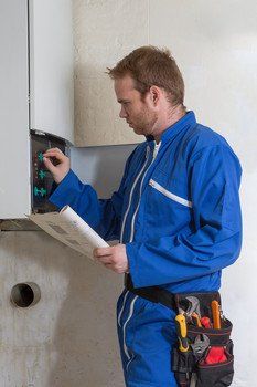 Man checking boiler