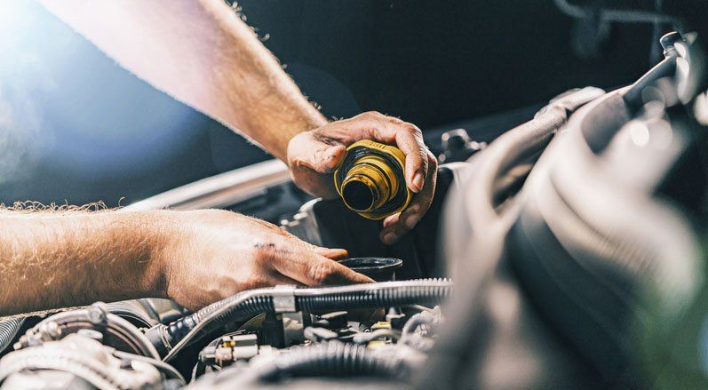 Hand Mechanic in Repairing Car — Johnstown, PA — S & S Auto Salvage