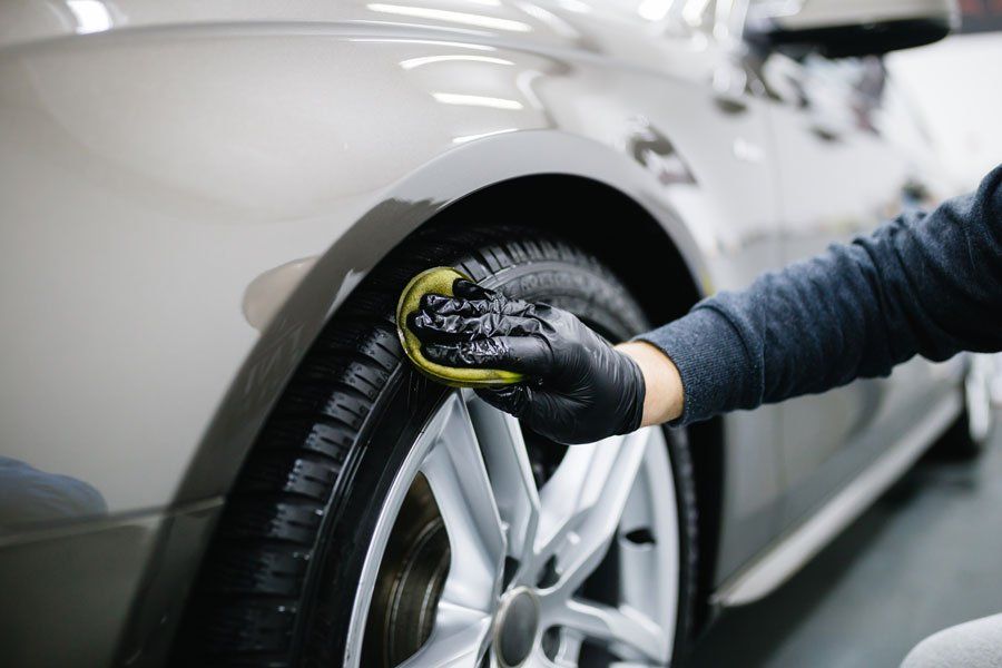 A Man Cleaning Car with Microfiber  Cloth — Johnstown, PA — S & S Auto Salvage