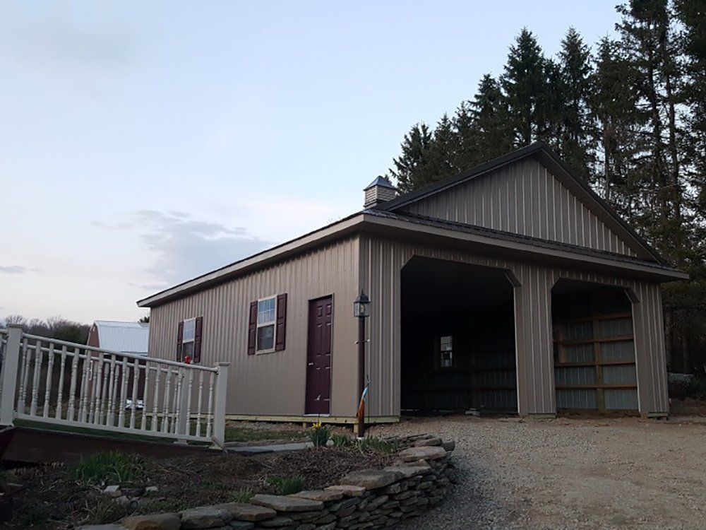 A house with a garage and a white railing