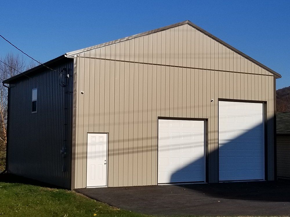 A large building with two white garage doors