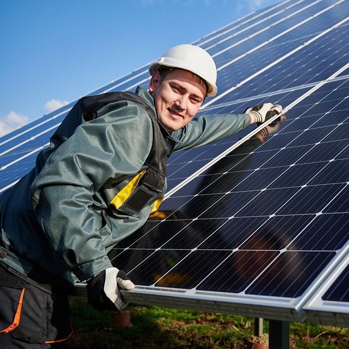 Electrician Fixing the Solar Panel — Grandview, WA — Tolman Electric, Inc Electrician Fixing the Solar Panel — Grandview, WA — Tolman Electric, Inc
