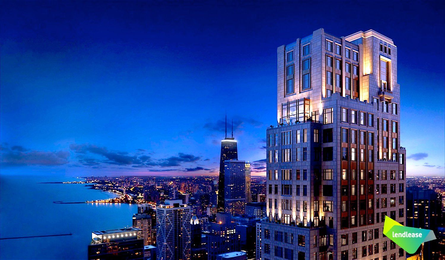 An aerial view of a city at night with a large building in the foreground.